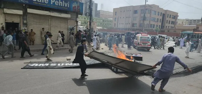 Severe protest erupted at Saddar's mobile market over an alleged blasphemous Wi-Fi device name that was being used by Samsung's staff.